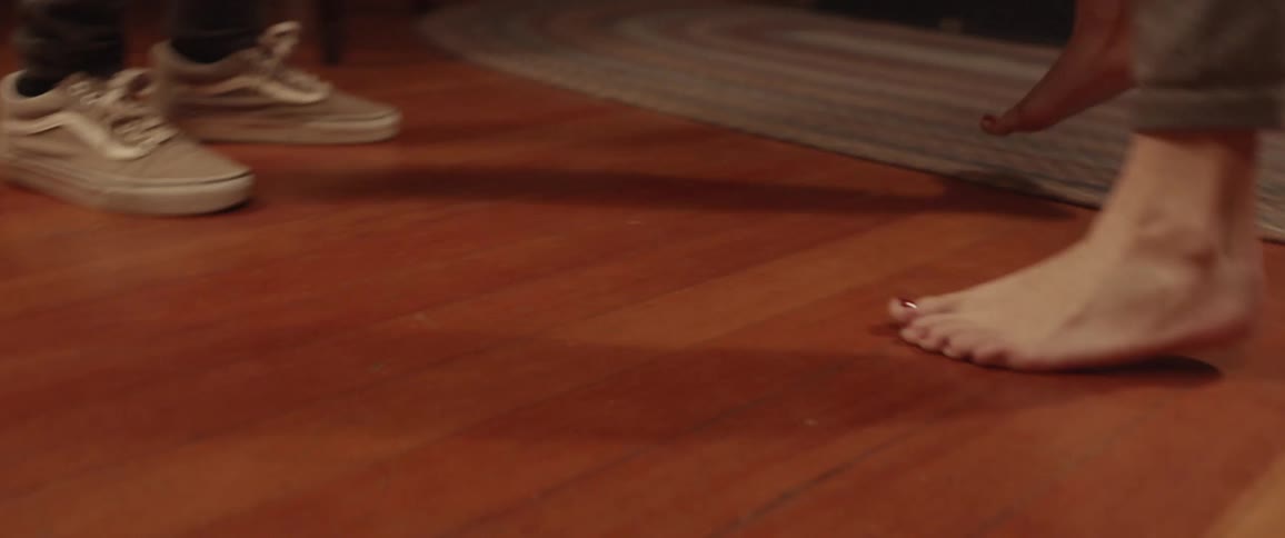 Couple of friends dancing in the living room