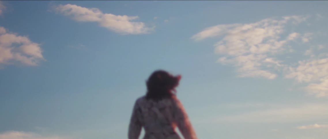 A woman walks outdoors