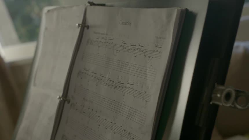Sheet music rests on a music stand