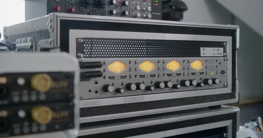 The radios are stacked on the table