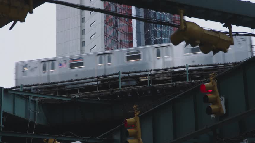 Train travels along metal tracks and carries people