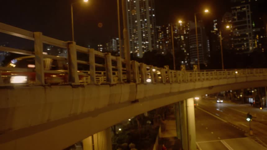 A downtown city is displayed with cars driving by