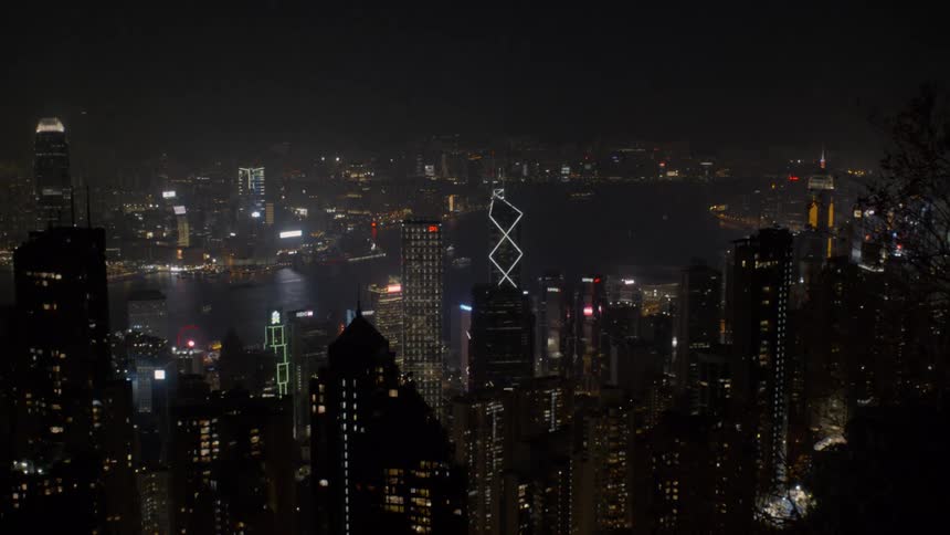 Riverfront city lights on the fog at night