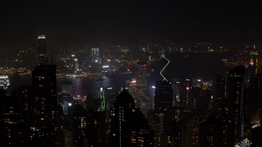 A city skyline at night lit up by myriad lights