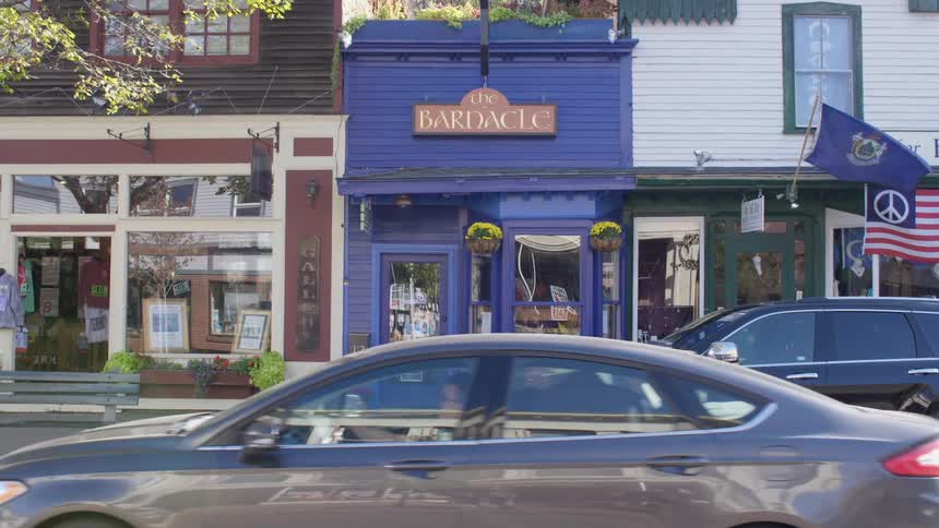 Storefront on small town street at day