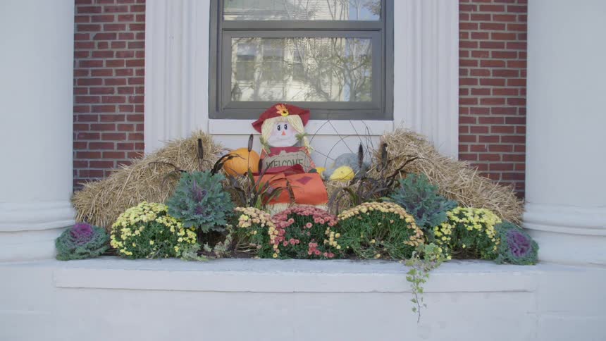 Flowers and decorations are displayed at a house