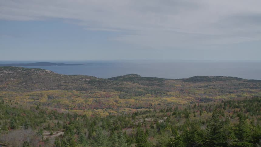 View of a region of gently rolling hills and calm sea