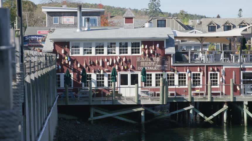 A bar on a dock on the water