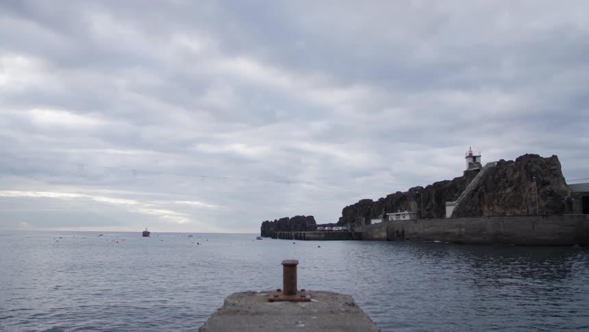 Buildings sit on the coast of an ocean bay