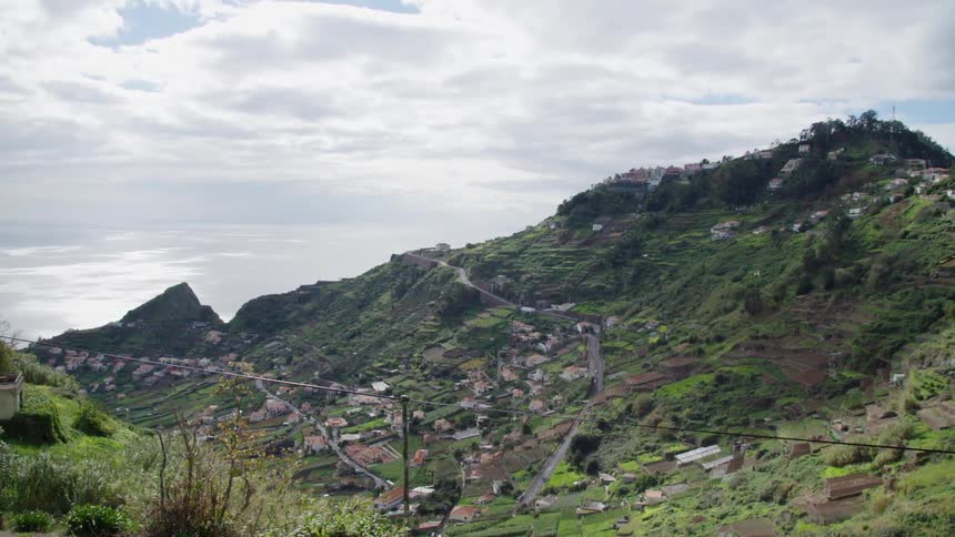 Houses sit on the mountains