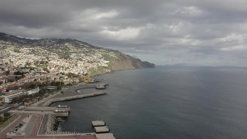 Aerial shot of a city by an ocean