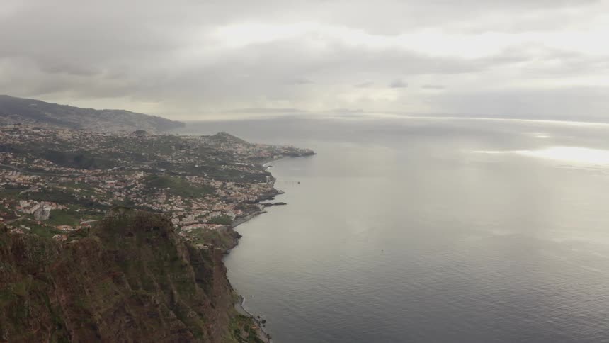 A coastal city with the sky in the background