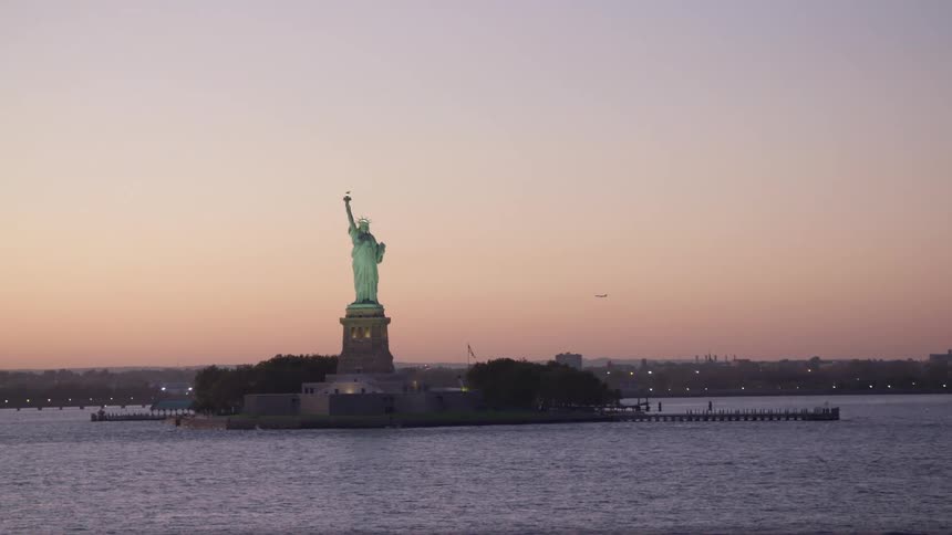 The statue of liberty at dusk