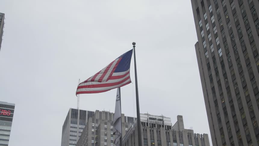 An american flag waiving in the wind