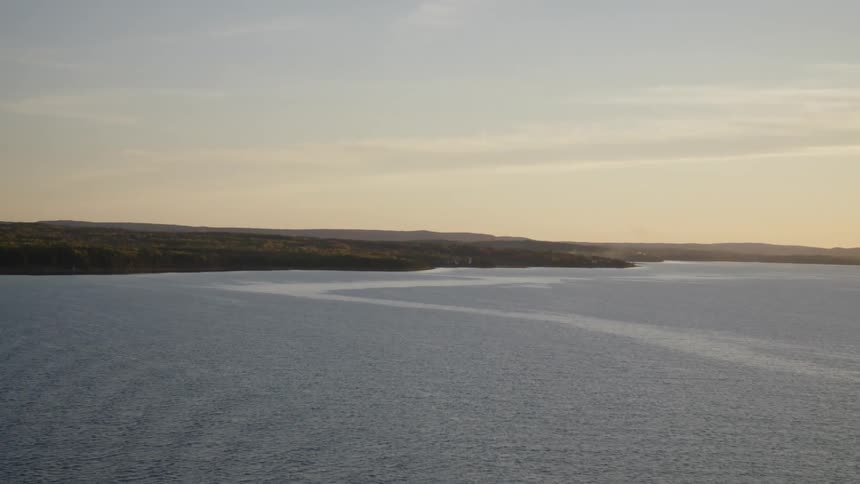 Aerial view of the calm sea and distant coast