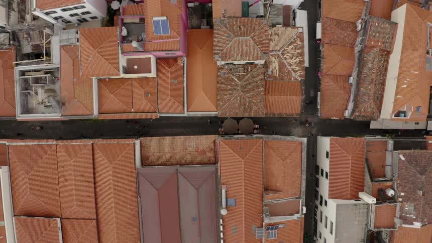 Aerial view of rooftops and streets in the neighborhood