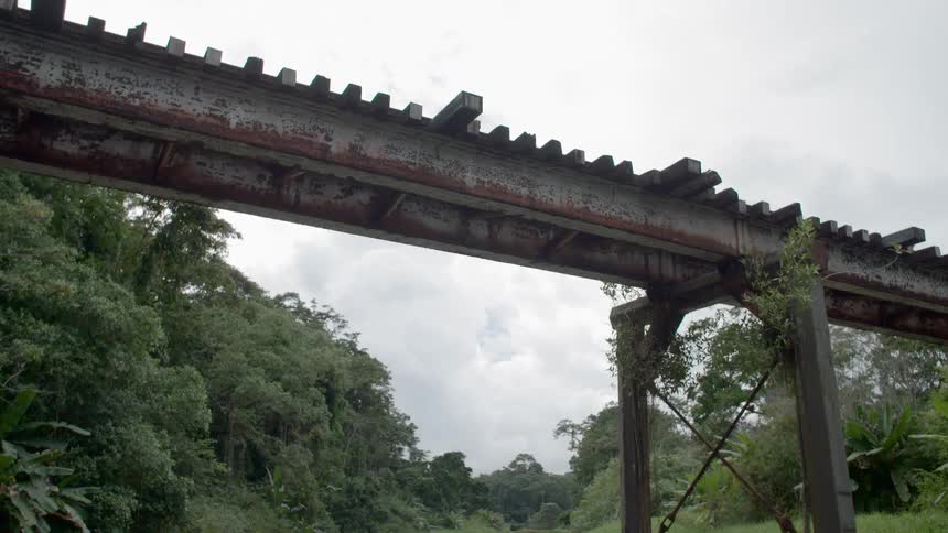 Small third world road rail bridge over a river
