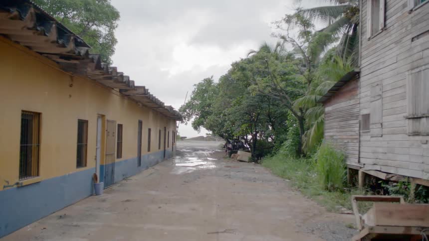 Street of a small tropical village at day