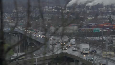 Traffic flows on an overpass at dusk
