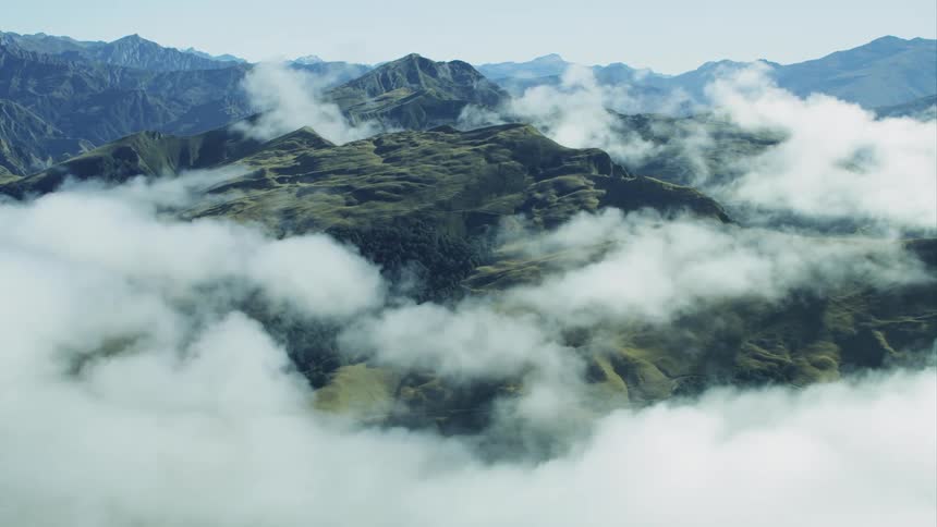 Aerial view of the mountains covered with clouds