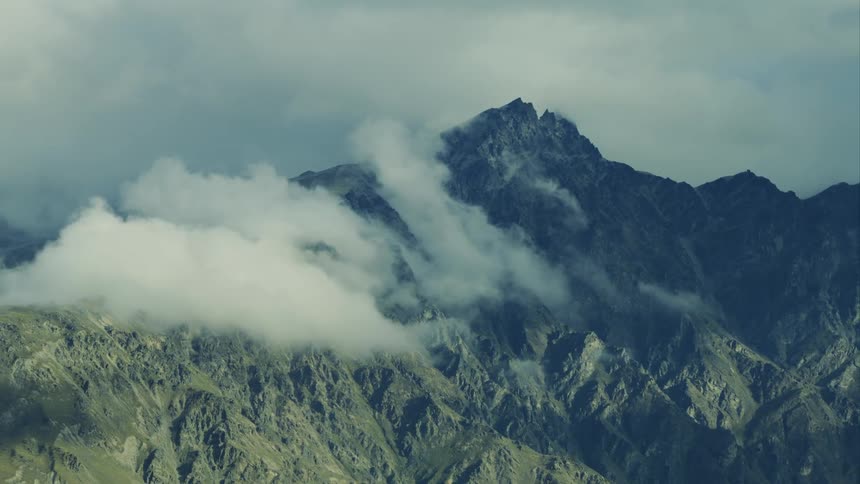 Aerial view of the mountains covered with clouds