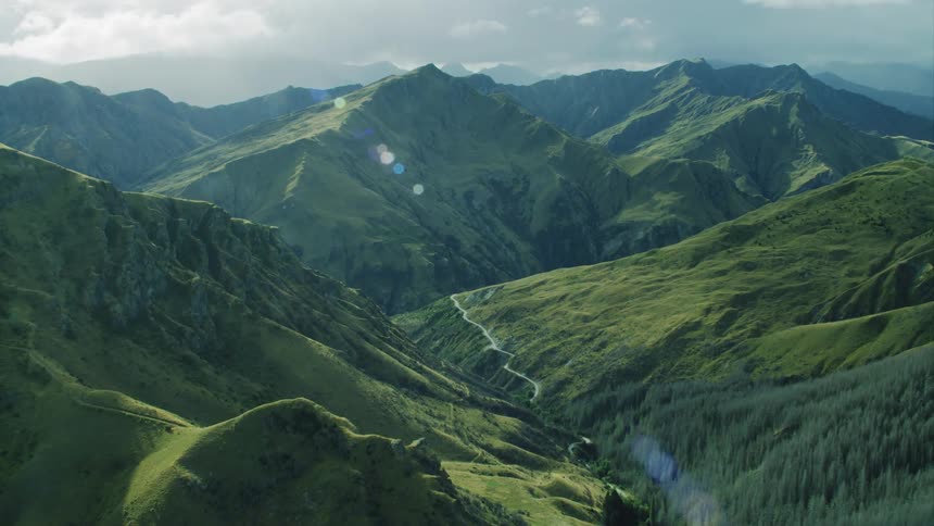 The mountains surround a forest