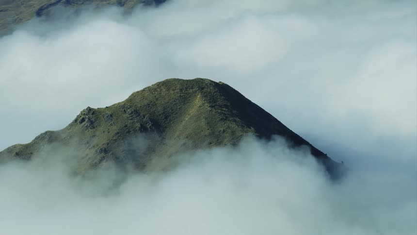 A mountain range surrounded by clouds