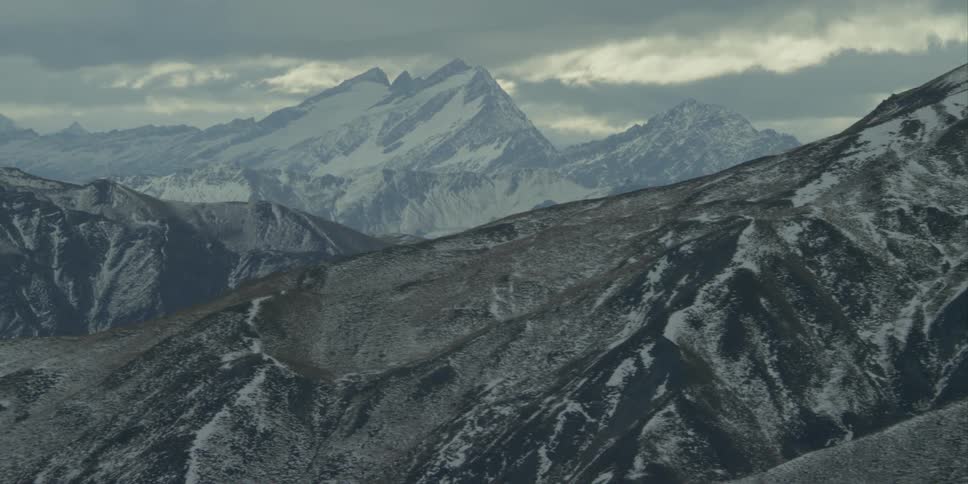Aerial view of a line of mountains covered with snow