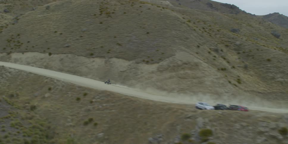 Aerial shot of a atv driving on a trail
