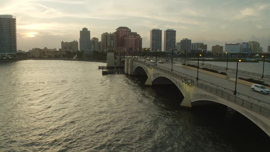 Aerial view of the city skyline and vehicles crossing the bridge