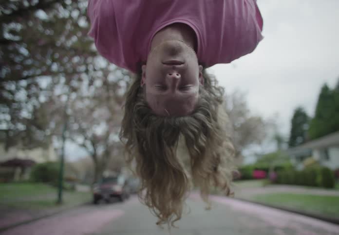 The woman hangs over the road