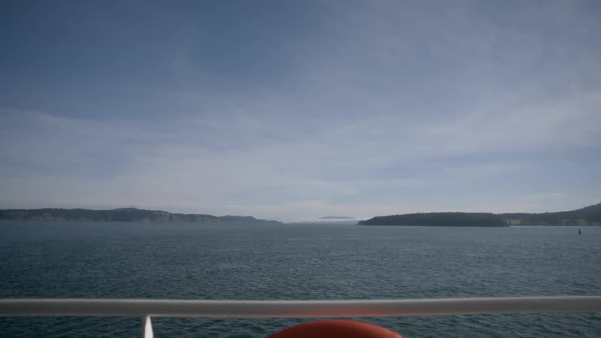 View from the railing of a boat over a large body of water