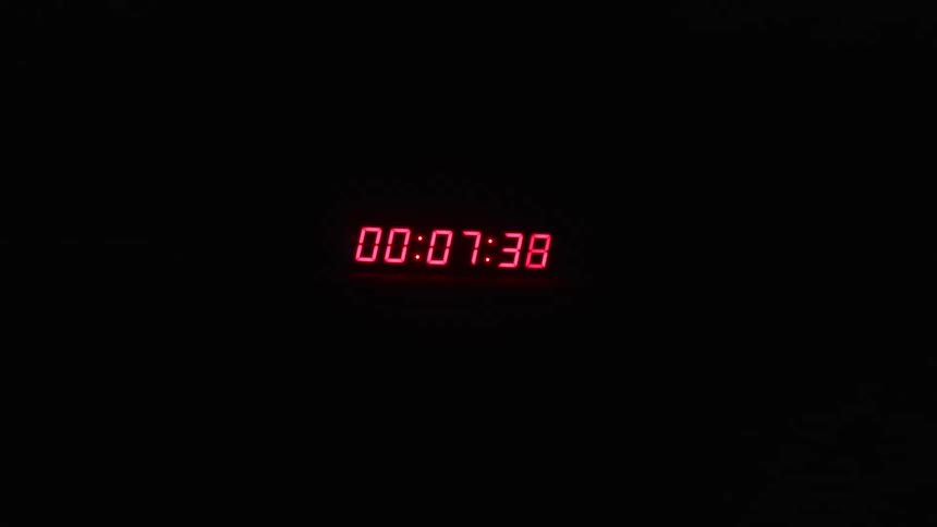 A clock timer counts down to zero while a light flashes