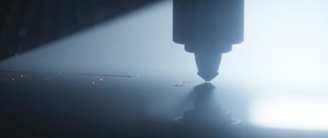 A laser cutter cutting a sheet of material