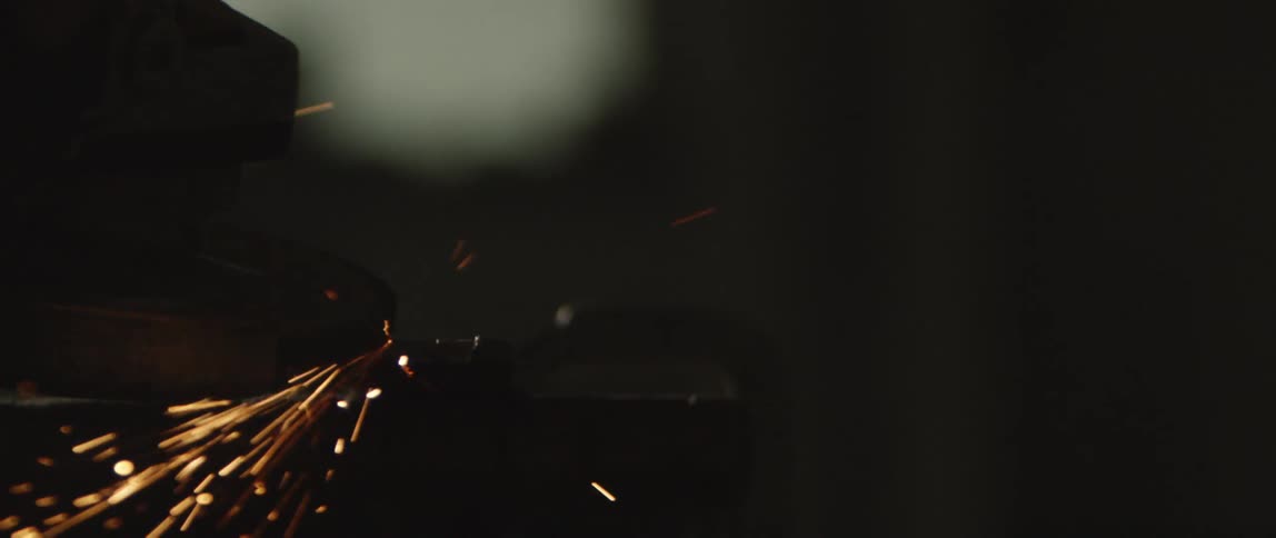 Red sparks shoot out in the dark