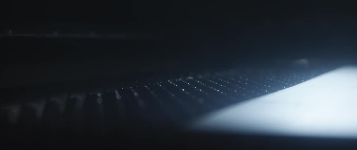 Close up of an out of focus surface on a dimly lit room