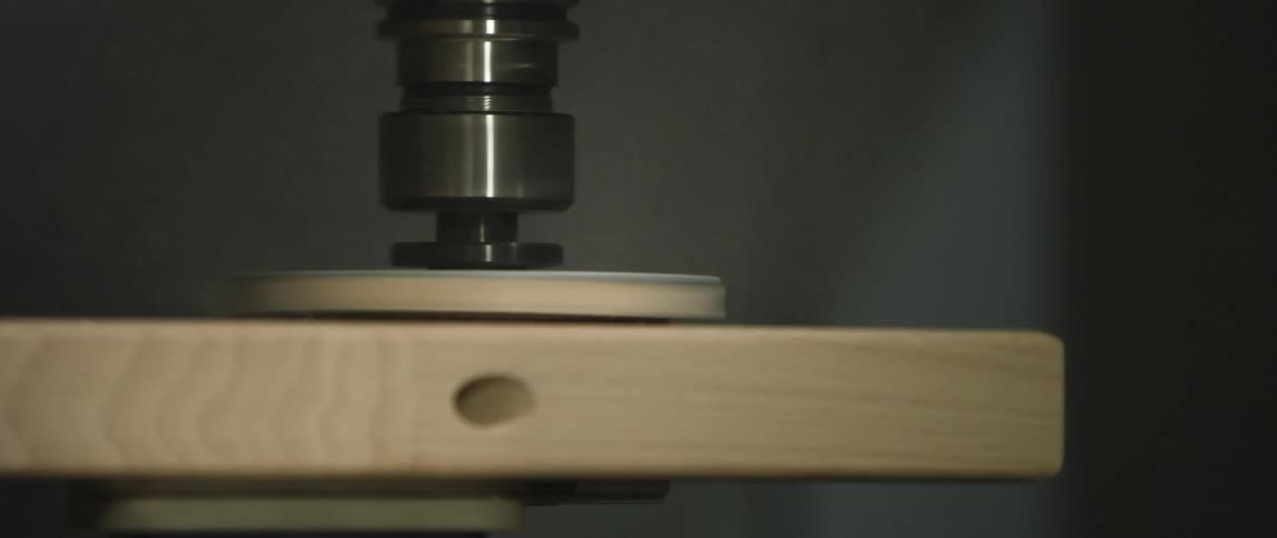 Circular sanding machine on wood