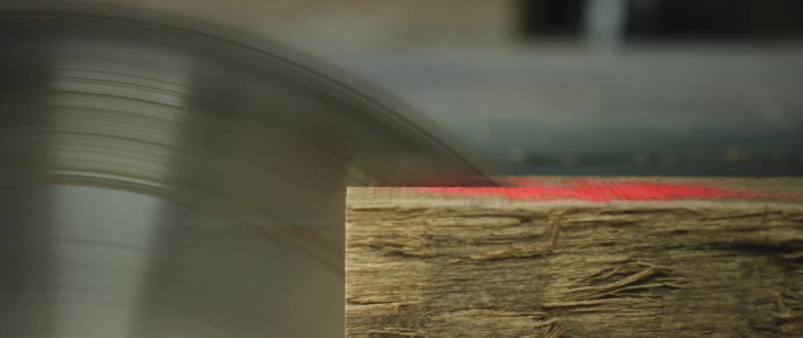 A machine is cutting wood