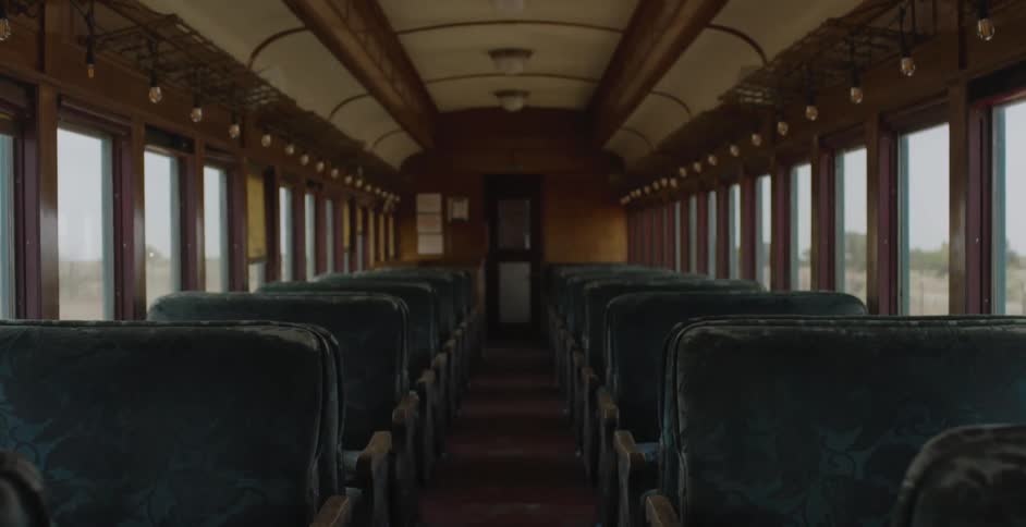 An empty train car bounces as it moves down the tracks