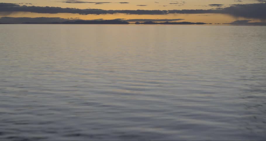 A lake with the sky in the background