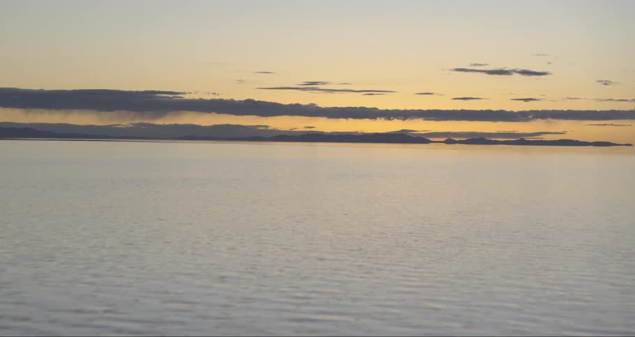 View of the calm ocean at sunrise