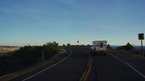 Camper traveling on a highway through the desert