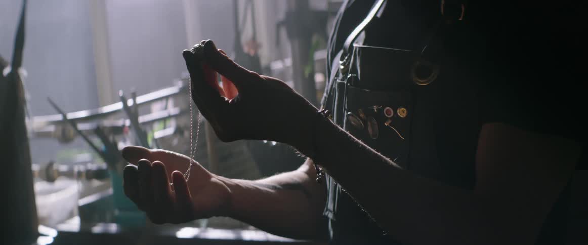 A jeweler examines a gem