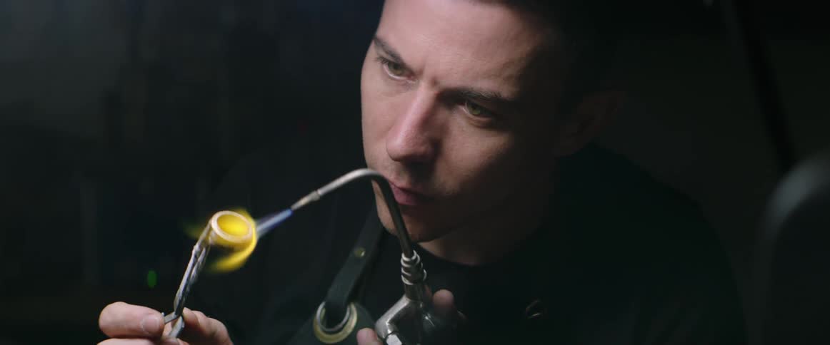 A man uses a torch to heat on a ring