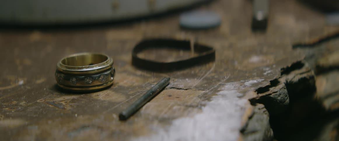 A ring lying on an old work bench