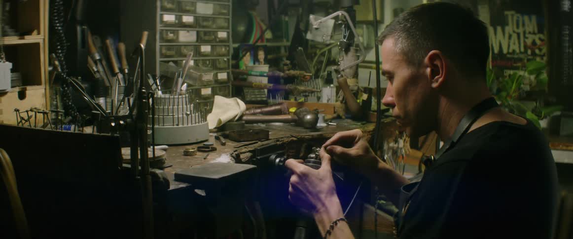 Man works with tools in a workshop