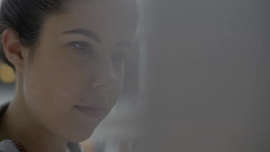 Close up of a woman blinking and looking forward