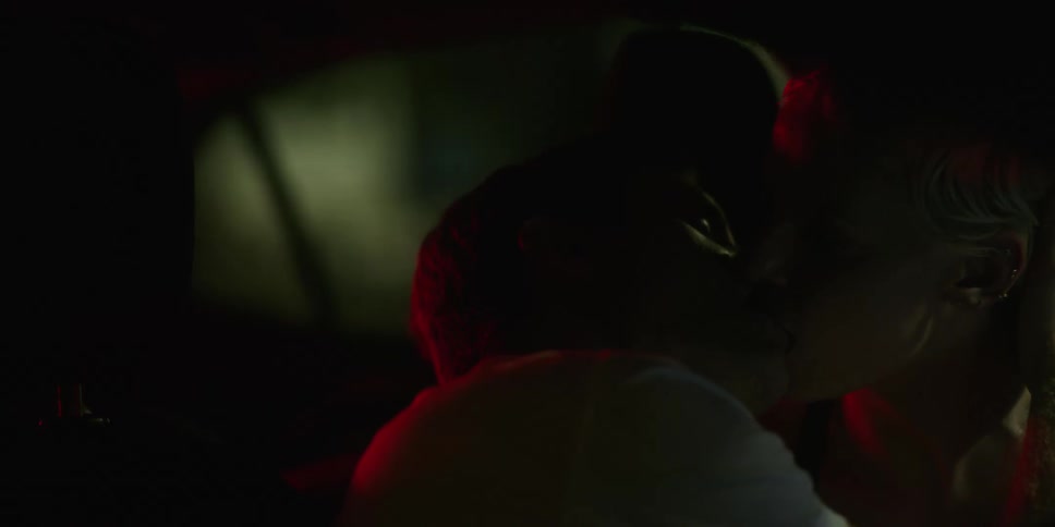 Couple kissing passionately in the dark