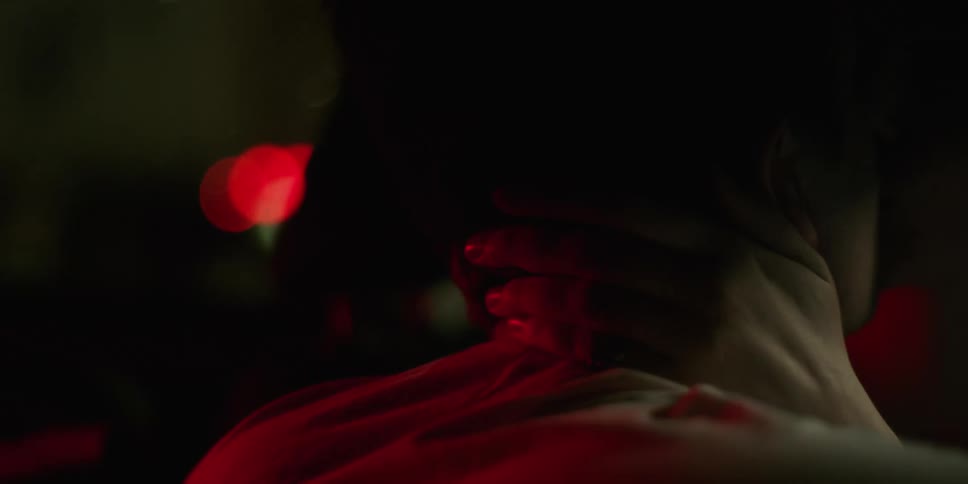 A man and woman are kissing passionately