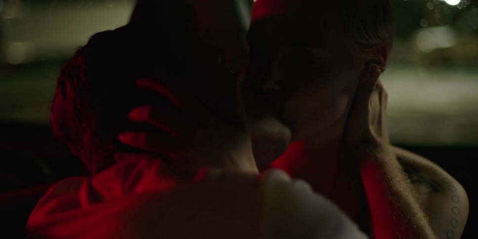 Two people make out in the car